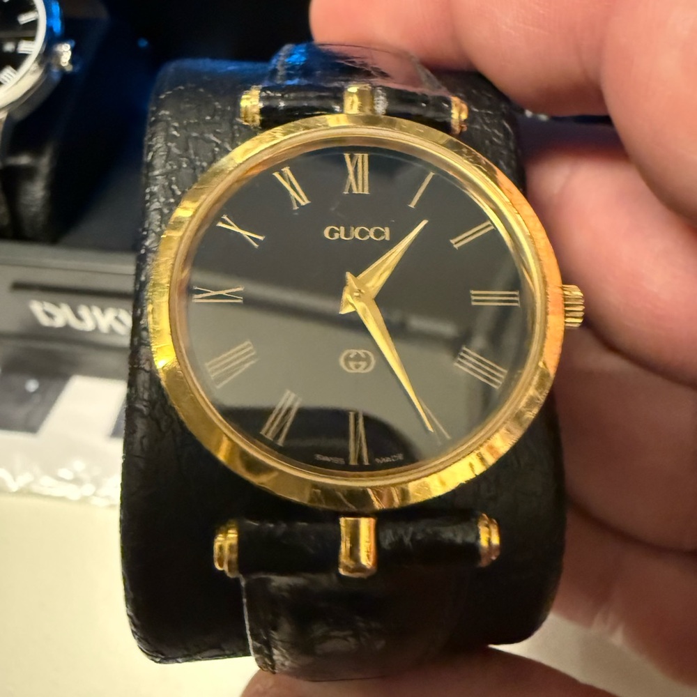 Gucci Men's Watch with Black Dial and Gold Detailing